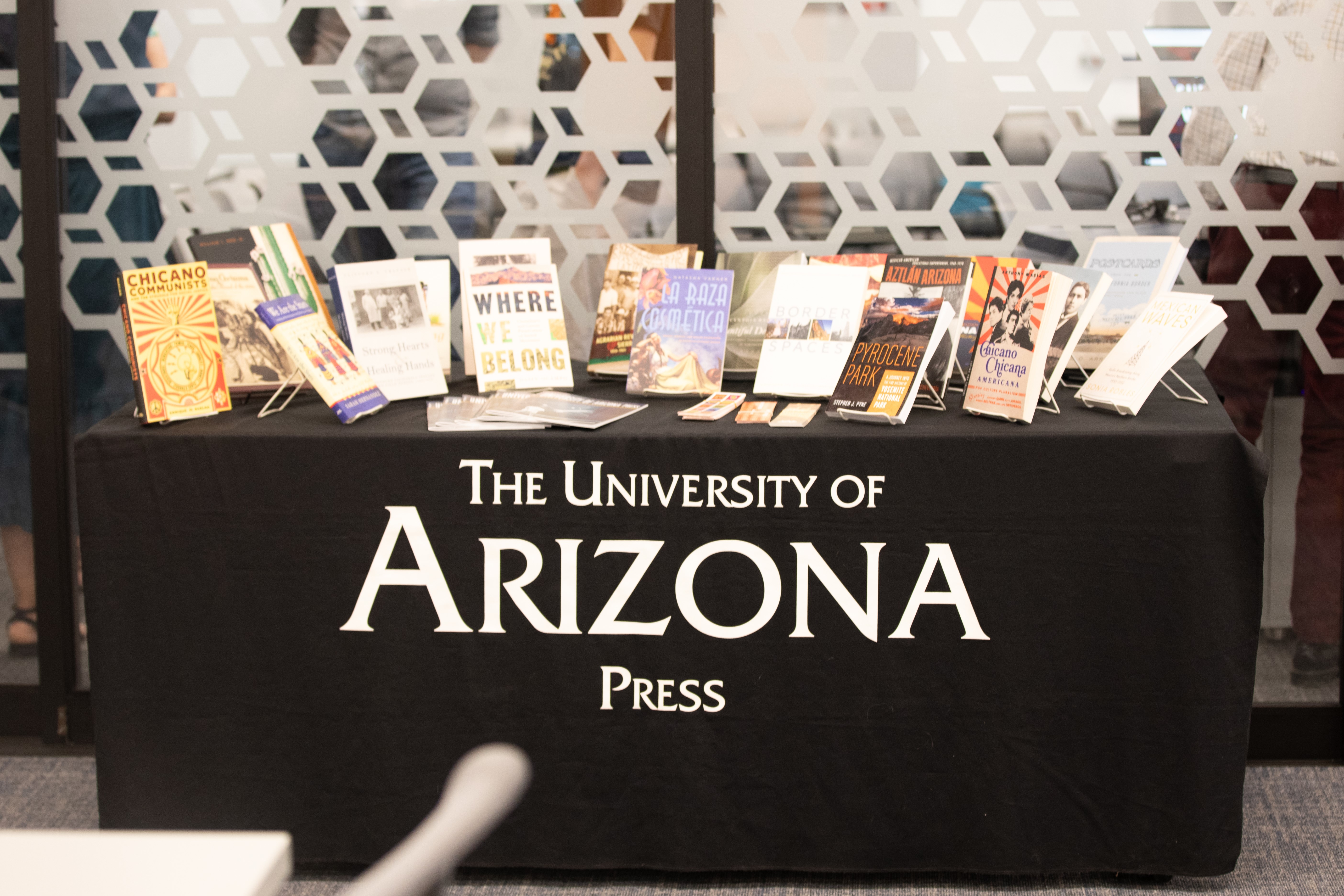 University of Arizona Press table with books displayed across the top